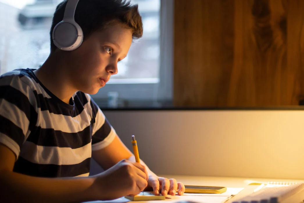 Teenager Taking Notes